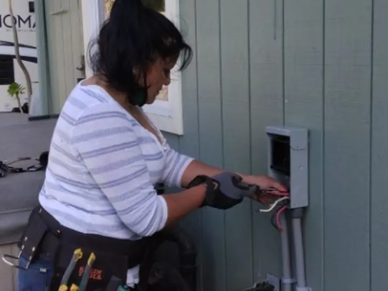 Licensed electrician wiring an exterior subpanel in Rio Pinar